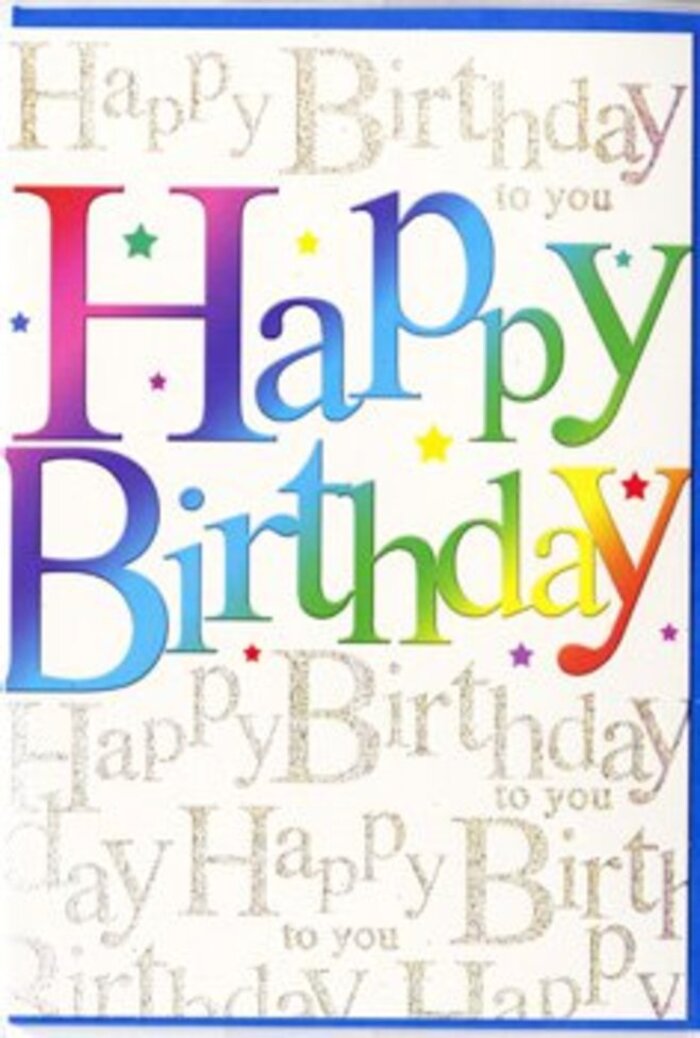 In the photo, a beautifully designed birthday card stands upright, its front capturing the same sense of joyful detail that goes into a carefully curated bouquet from a Weybridge florist. Across the middle, in confident, generously sized letters, the phrase Happy Birthday stretches from side to side. The lettering is filled with a continuous band of colour that sweeps through the whole rainbow, starting with rich wine reds and crimson tones, then flowing into pinks, plums, and velvety purples. From there, the colours drift into vivid cobalt blues, aquas, and teals before merging into zestful limes, leafy greens, and finally soft honey and buttercup yellows, as if each letter has been brushed with the hues of a festive street scene near Weybridge station. The letters sit atop a background that glows softly in pale cream, entirely covered in a fine pattern of repeating golden script spelling out Happy Birthday to you in an elegant, looping hand. This metallic script shimmers gently, reminiscent of fairy lights reflected in the Thames by the rowing club, offering a refined counterpoint to the exuberant colours at the front. Scattered around the central phrase, tiny multi-coloured stars and confetti dots add a light, playful sparkle, much like petals falling around a bouquet. The printing appears crisp, and the metallic gold catches highlights as though the card would subtly change as you tilt it in your hands. The card stock itself looks smooth, with a subtle sheen that suggests quality and care in its production. Altogether, the design feels festive yet tasteful, the sort of birthday card you might send alongside a luxurious arrangement delivered through Weybridge and the surrounding Surrey villages by Flower Delivery Weybridge, creating a layered and thoughtful birthday gesture.