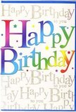 The scene shows a single birthday card positioned upright, its front brimming with colour and warmth in a way that mirrors the cheerful spirit of Weybridge's local celebrations. The main focus is the phrase Happy Birthday, written in large, rounded letters that arc gracefully across the centre of the card. Each letter is coloured with a fluid rainbow gradient, beginning with deep garnet and raspberry reds, sliding into pink and magenta, then shifting into regal violets, indigo, and ocean blues, before melting into turquoise, fresh grassy greens, lime, and finally soft golden yellow with a hint of peach. This seamless transition of colour gives the impression of a joyful spectrum, much like a cluster of balloons bobbing above a party near Churchfields Recreation Ground. Behind this statement text, the background is a gentle cream, fully overlaid with delicate metallic gold script repeating Happy Birthday to you in neat, cursive loops. The gold adds a fine, glistening texture that catches the light subtly, akin to the glimmer of sunlight on the River Wey, lending elegance to the design. Small decorative accents-tiny stars, dots, and flecks in bright rainbow shades-are scattered with restraint around the main lettering, suggesting confetti in slow motion and enhancing the sense of celebration. The card stock appears smooth and slightly shiny, suggesting a comfortable, high-quality feel when handled. Overall, the card's combination of vivid colour, glimmering gold, and balanced composition makes it ideal for marking an important birthday, especially when teamed with a lively bouquet delivered to a doorstep in Weybridge, Oatlands, or Brooklands, turning a simple greeting into a heartfelt and memorable moment.